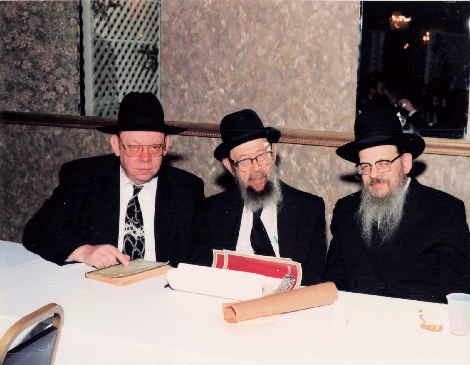 Rav Avigdor Miller zt״l seated at a table with sefarim